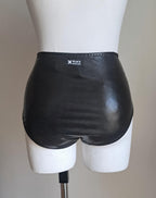 Black wet-look high waist panties on a mannequin against a plain background