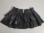 Black wet-look open front mini skirt on a light gray background