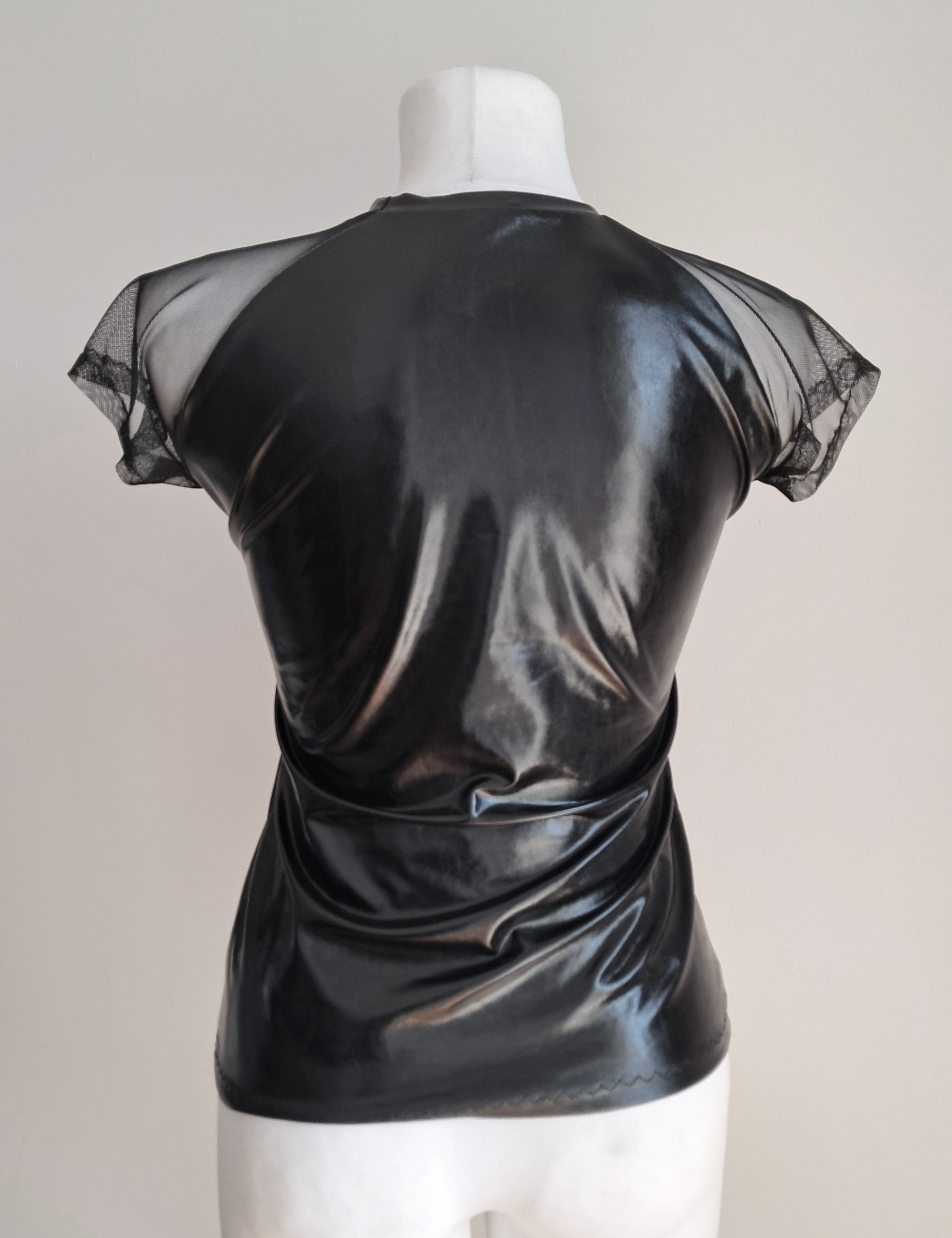 Black wet-look mesh sleeve t-shirt on a mannequin against a plain background