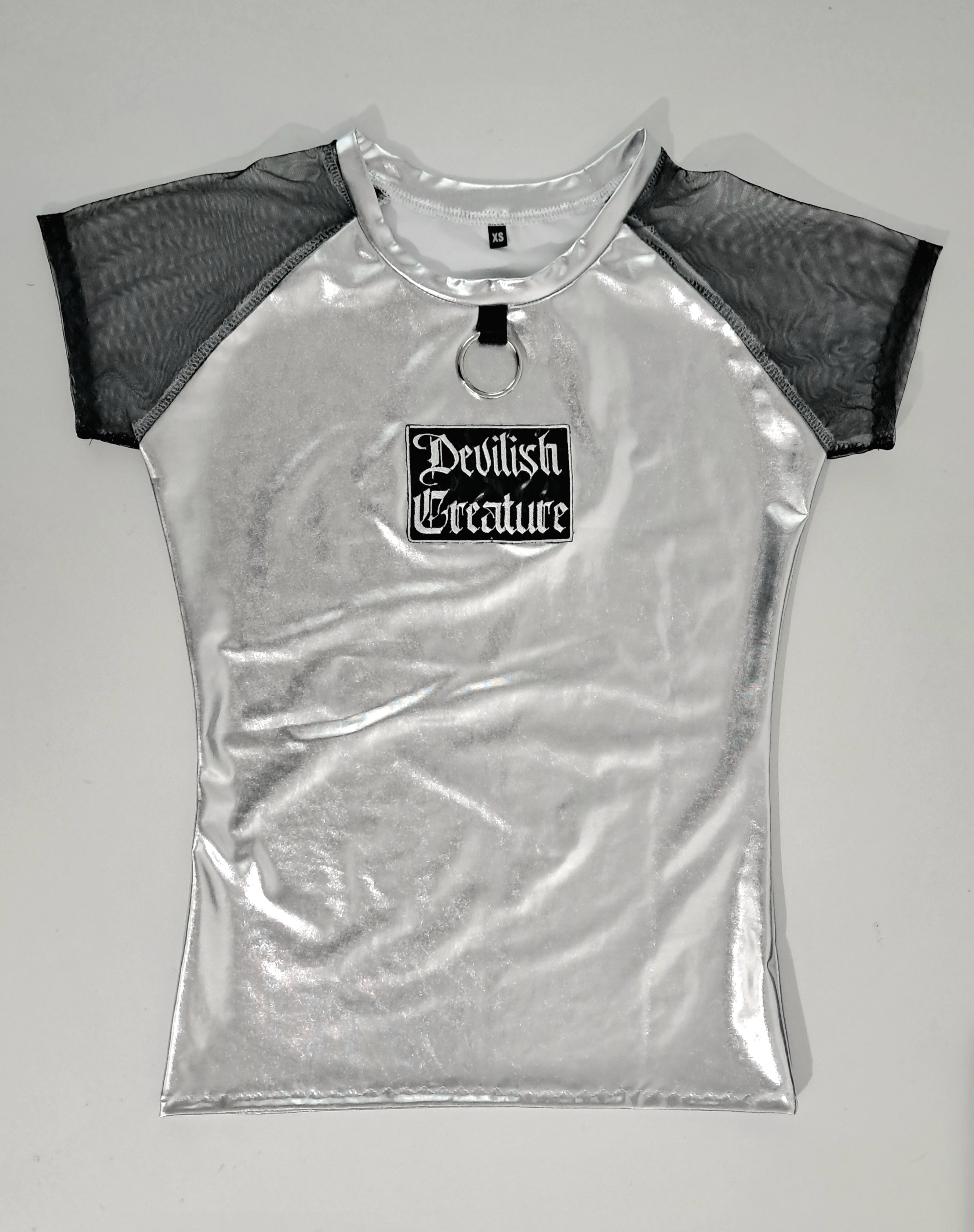 Silver metallic wet-look mesh sleeve t-shirt with on a gray background