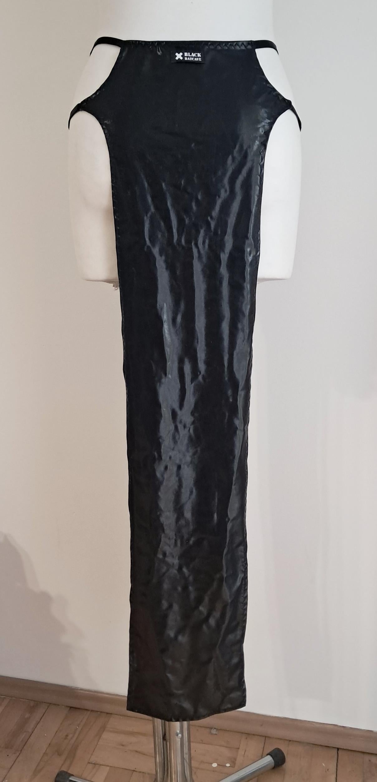 Black wet-look cut-out maxi skirt on a mannequin against a plain background