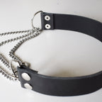 Black leather choker with silver chain on a white background