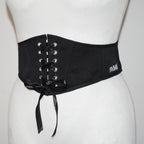 Black corset belt with lace-up design on a mannequin against a white background