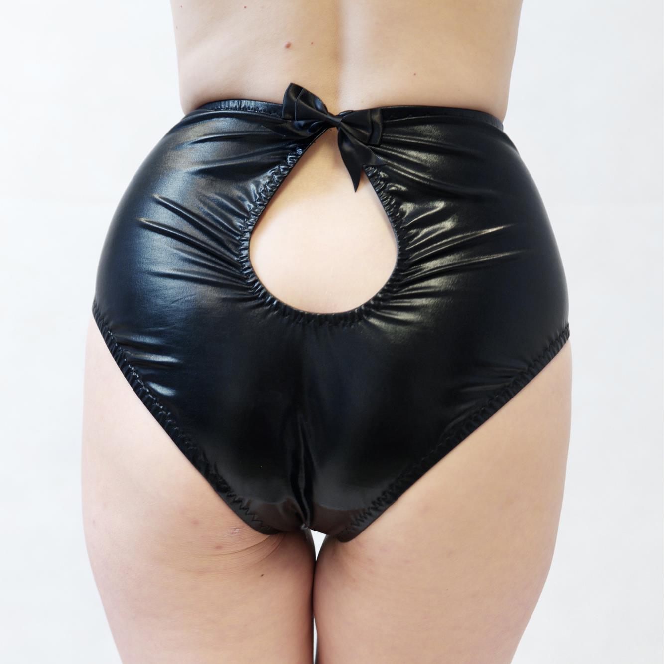 Black wet-look cut-out panties on a white background