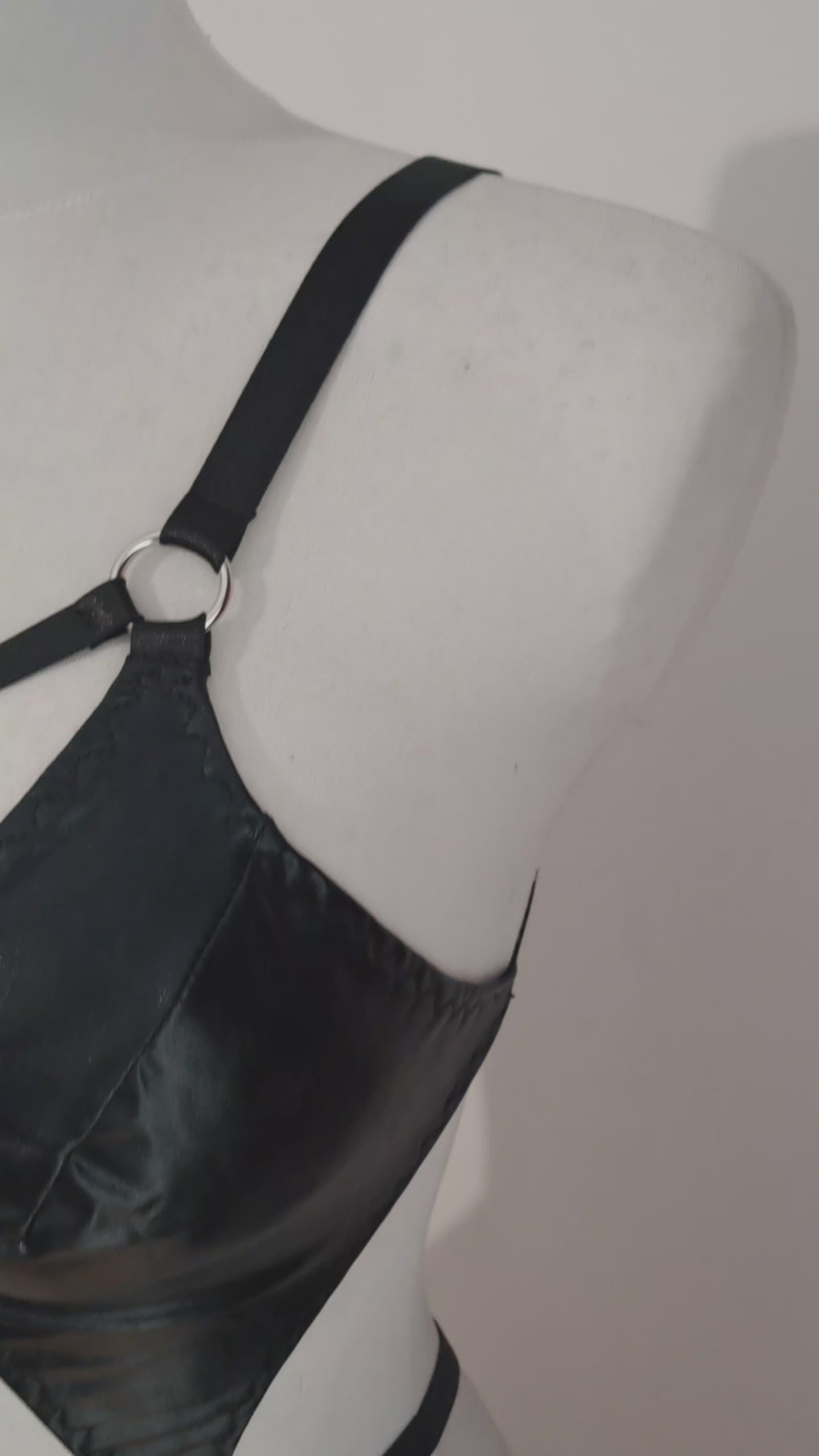 black bodysuit shown on mannequin