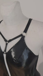 black wet look bodysuit presented on mannequin