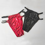 Red and black wet-look cut-out panties on a white background