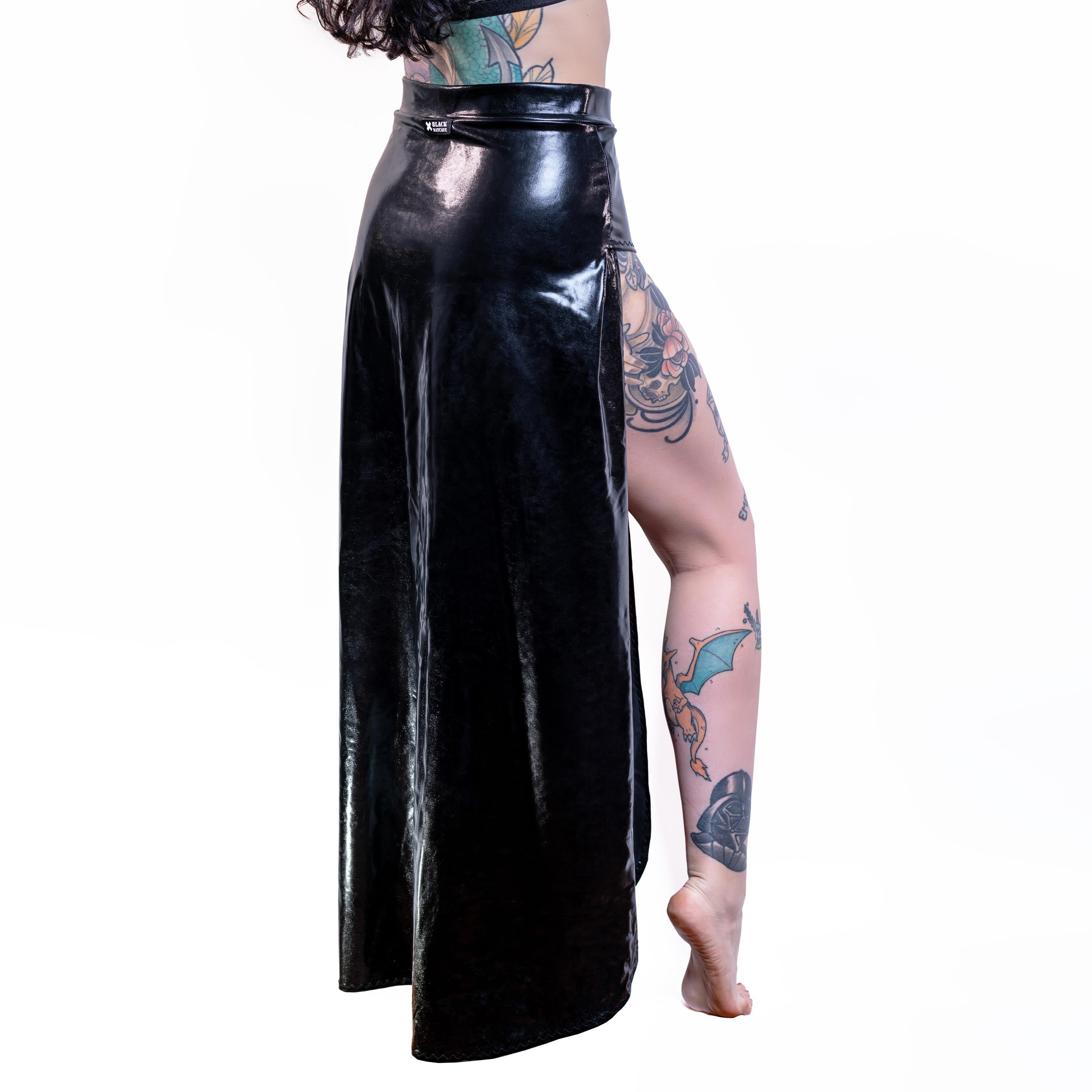 Person wearing a wet-look cut-out maxi skirt on a white background