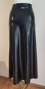 Black wet-look cut-out maxi skirt on a mannequin against a plain background