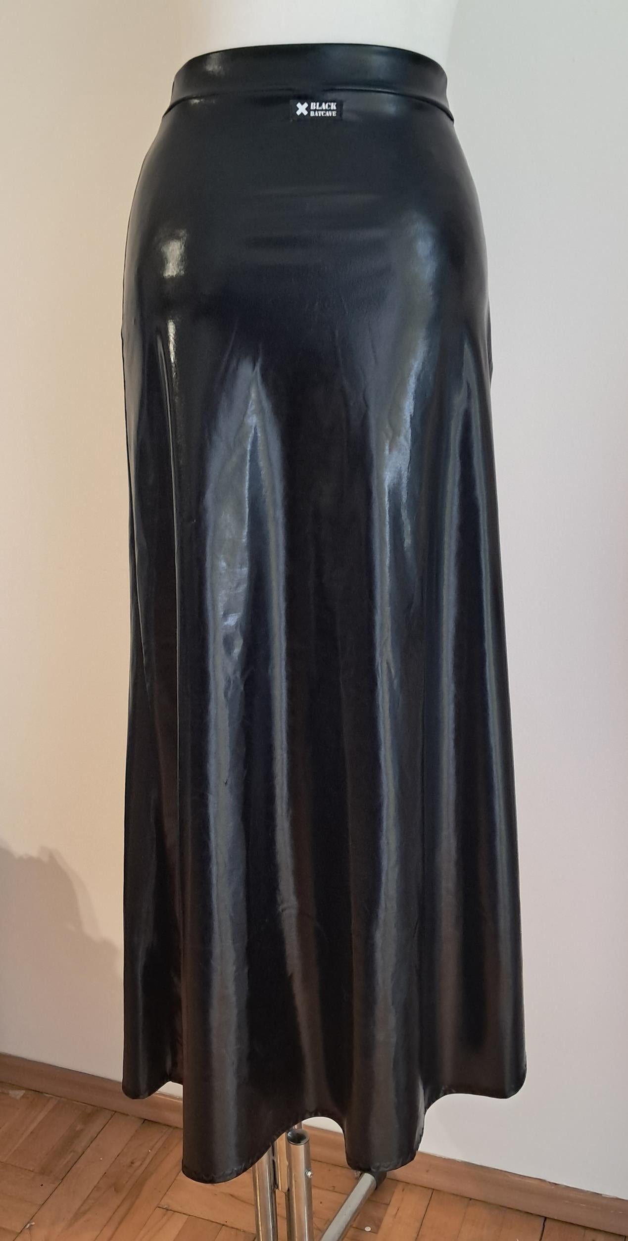 Black wet-look cut-out maxi skirt on a mannequin against a plain background