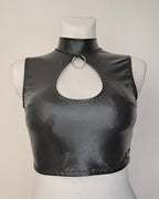 Black wet-look sleeveless crop top on a mannequin with a plain background