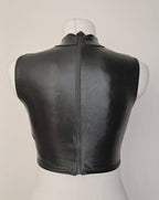 Black wet-look sleeveless crop top on a mannequin against a plain background