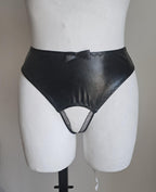 Black wet-look open crotch panties on a mannequin against a plain background