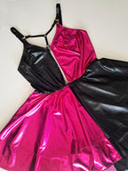 Black and pink metallic wet look flared dress on a white background