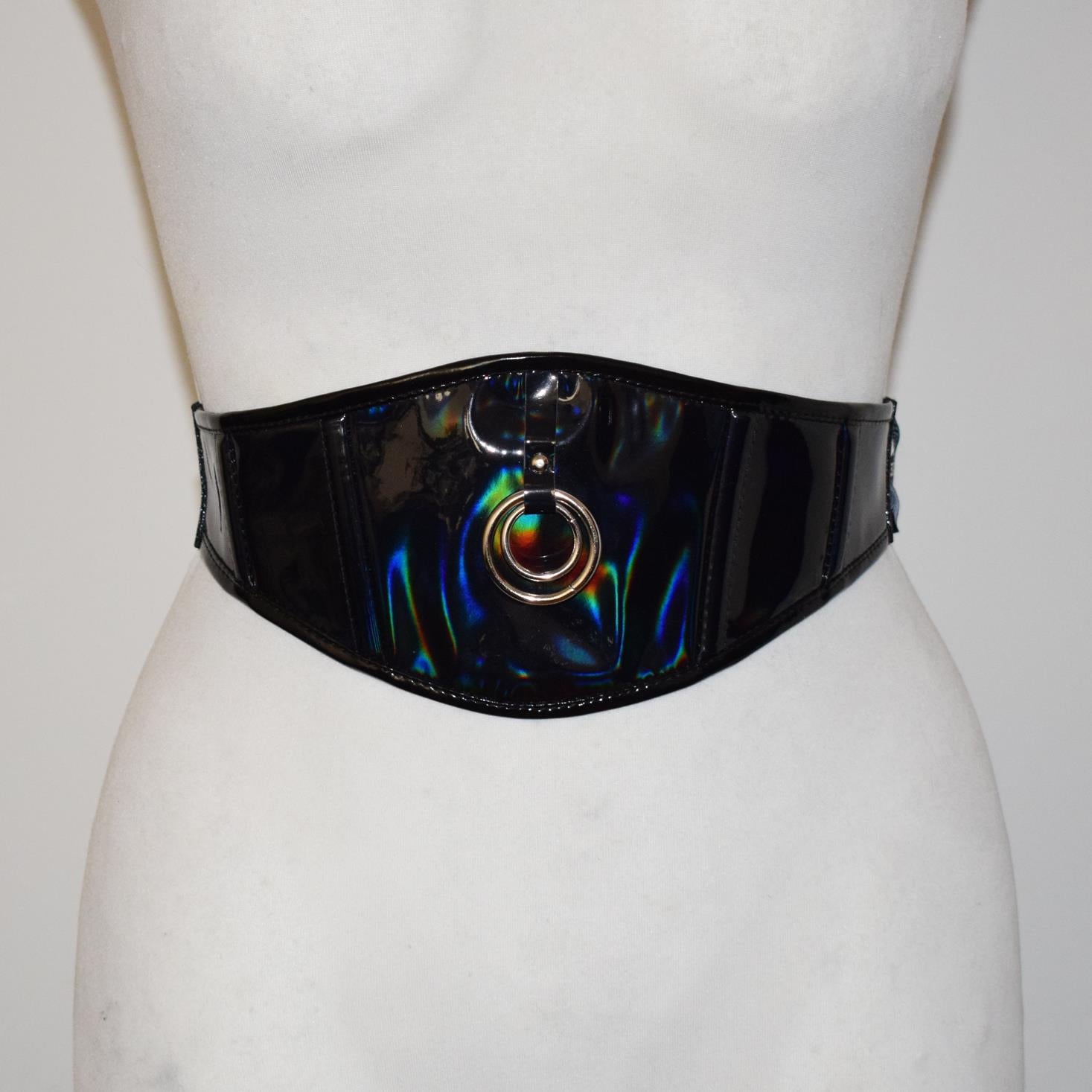 Black patent leather belt with colorful design on a mannequin against a white background