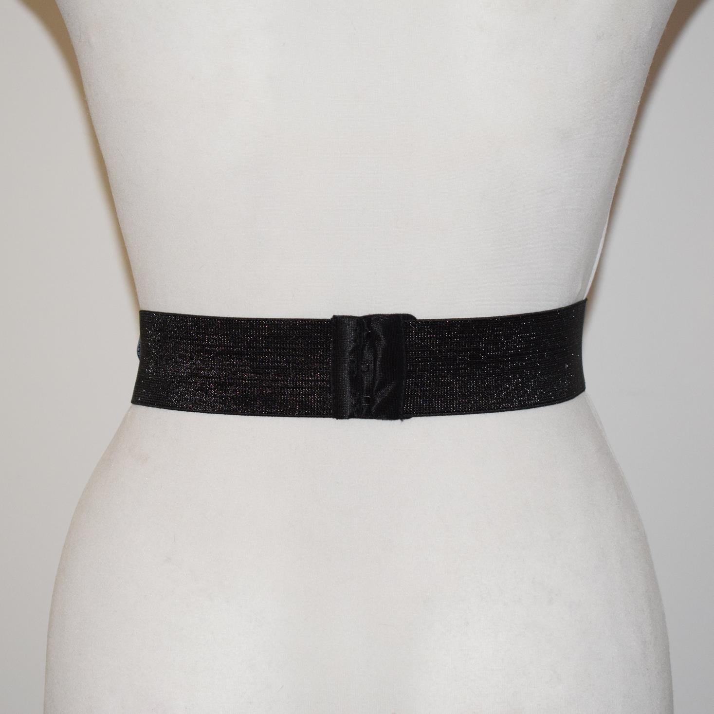 Black belt on a mannequin with a plain background