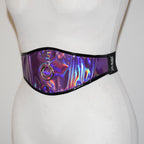 Holographic belt with a ring detail on a mannequin against a white background